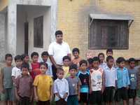 Orphanage Director Dipak Adhikari with the Children